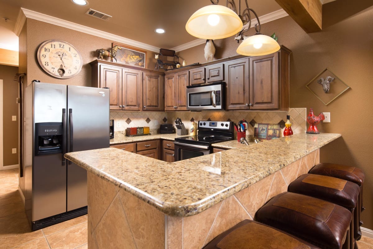 Village at Gruene condo kitchen with breakfast bar.