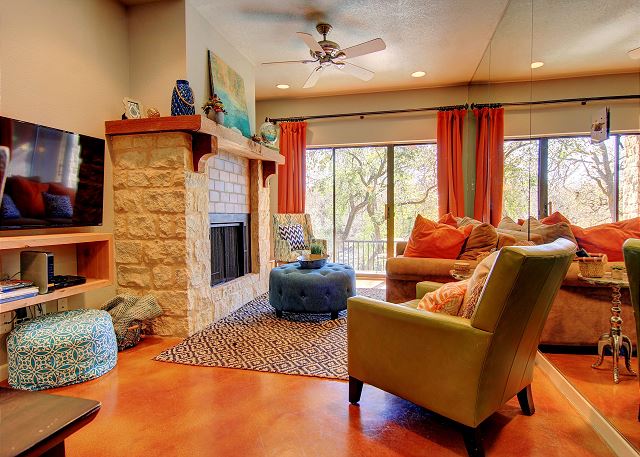 Camp Warnecke condo living room with fireplace.