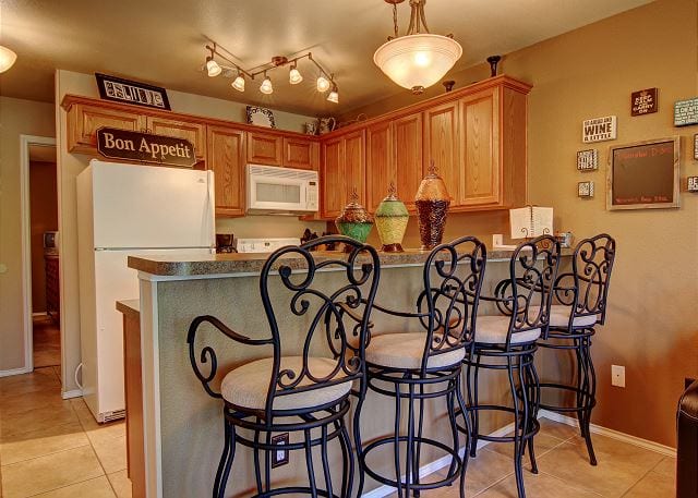 Waterwheel kitchen with breakfast bar.