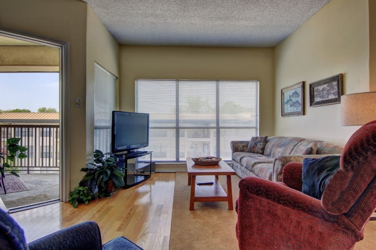 Inverness condo living room and balcony.