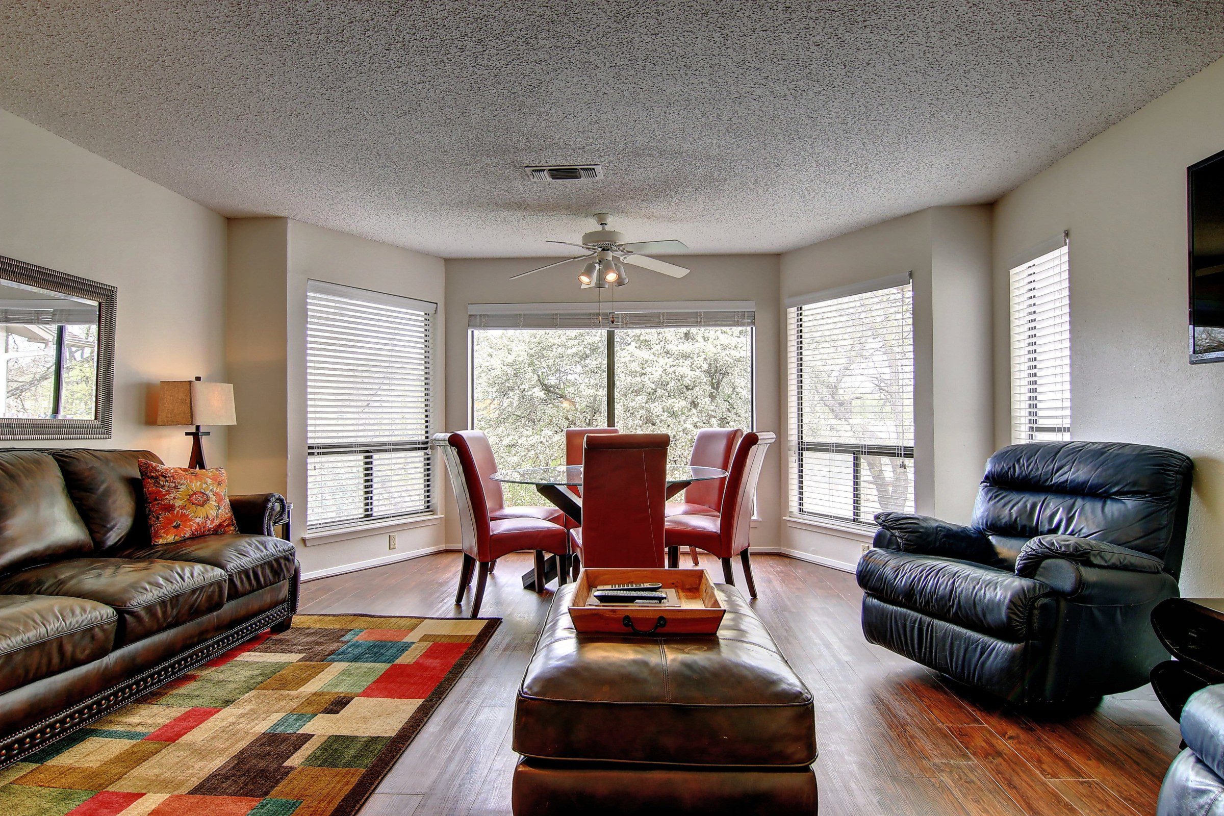 Comal River vacation home living room and dining table.