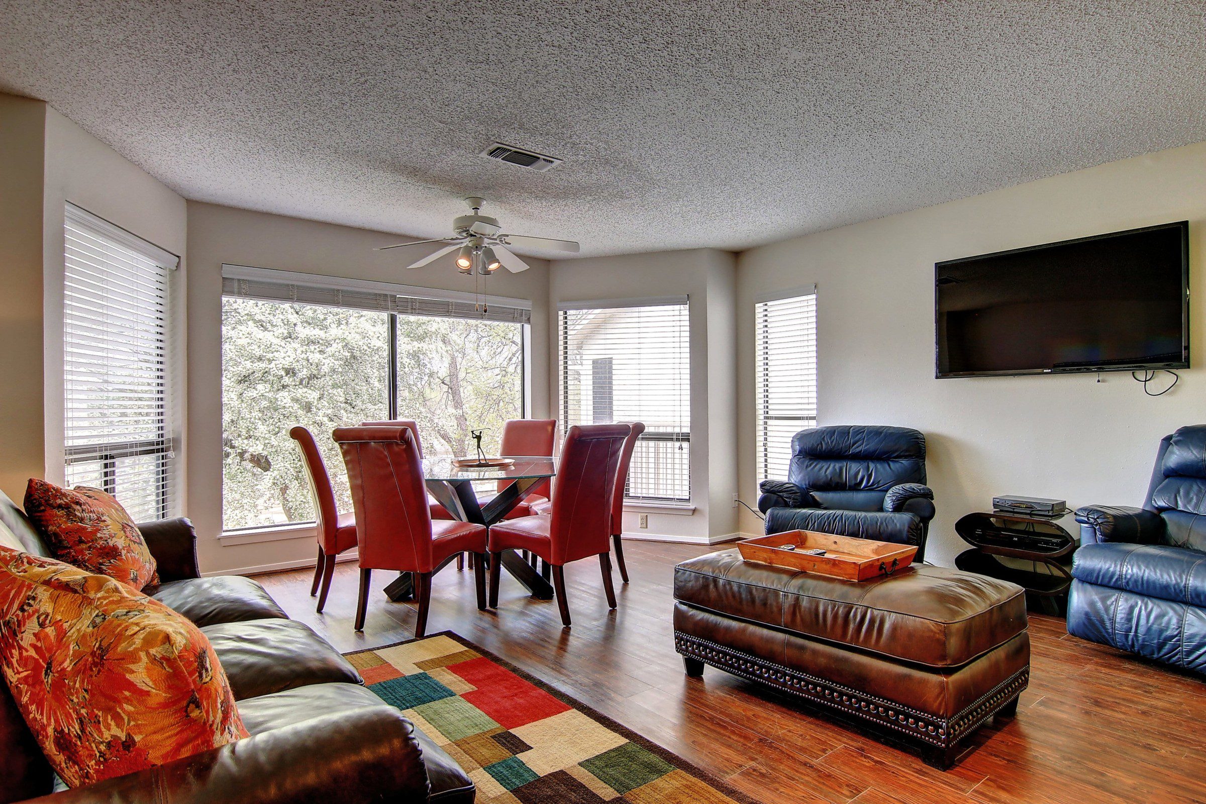 Comal River vacation home living room and dining table.