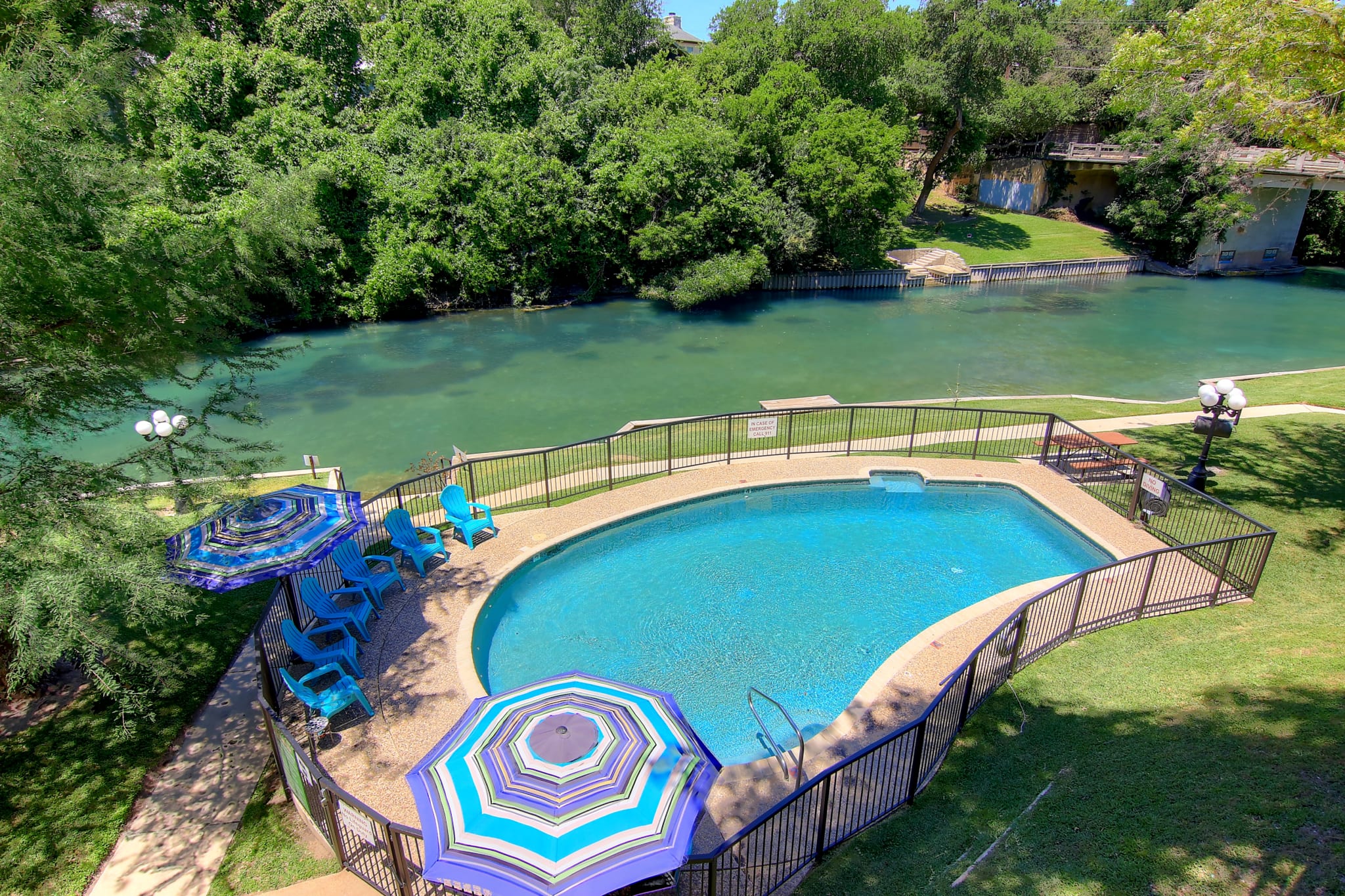 Inverness outdoor pool and Guadalupe River.