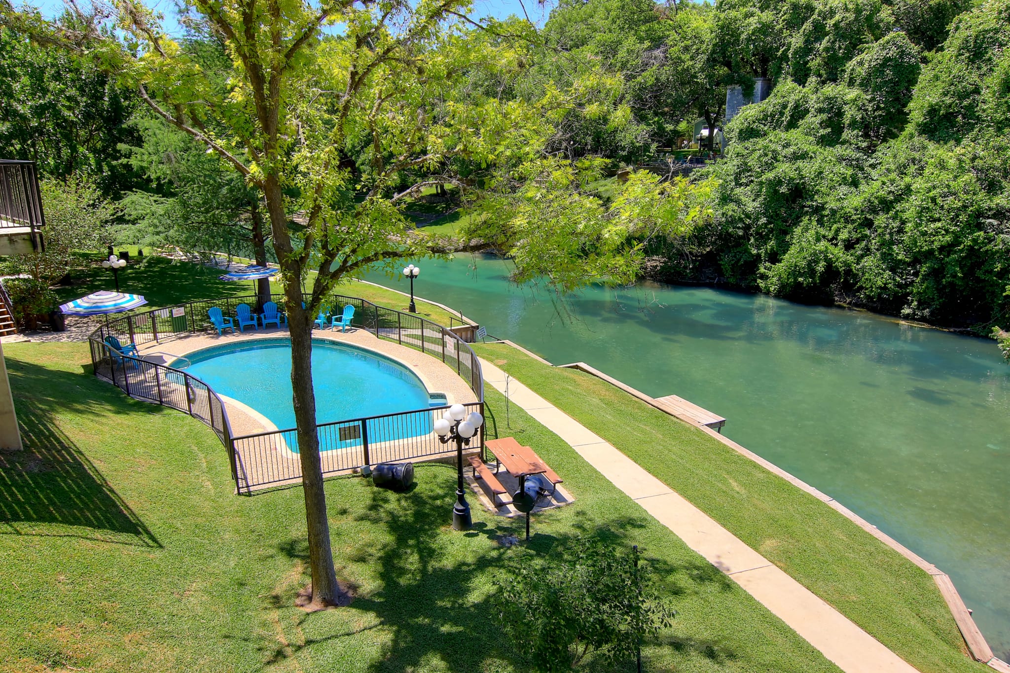 Inverness outdoor pool and Guadalupe River.