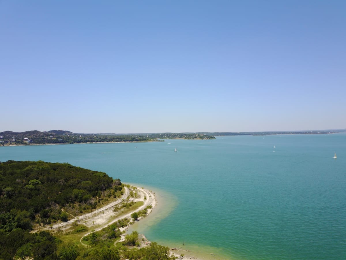 Landscape view of lake on a cloudless day.