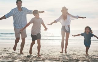 A family of four enjoying the beach. One of the many Things To Do With Family In New Braunfels.