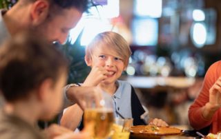 A young boy enjoying Restaurants In New Braunfels, Texas.