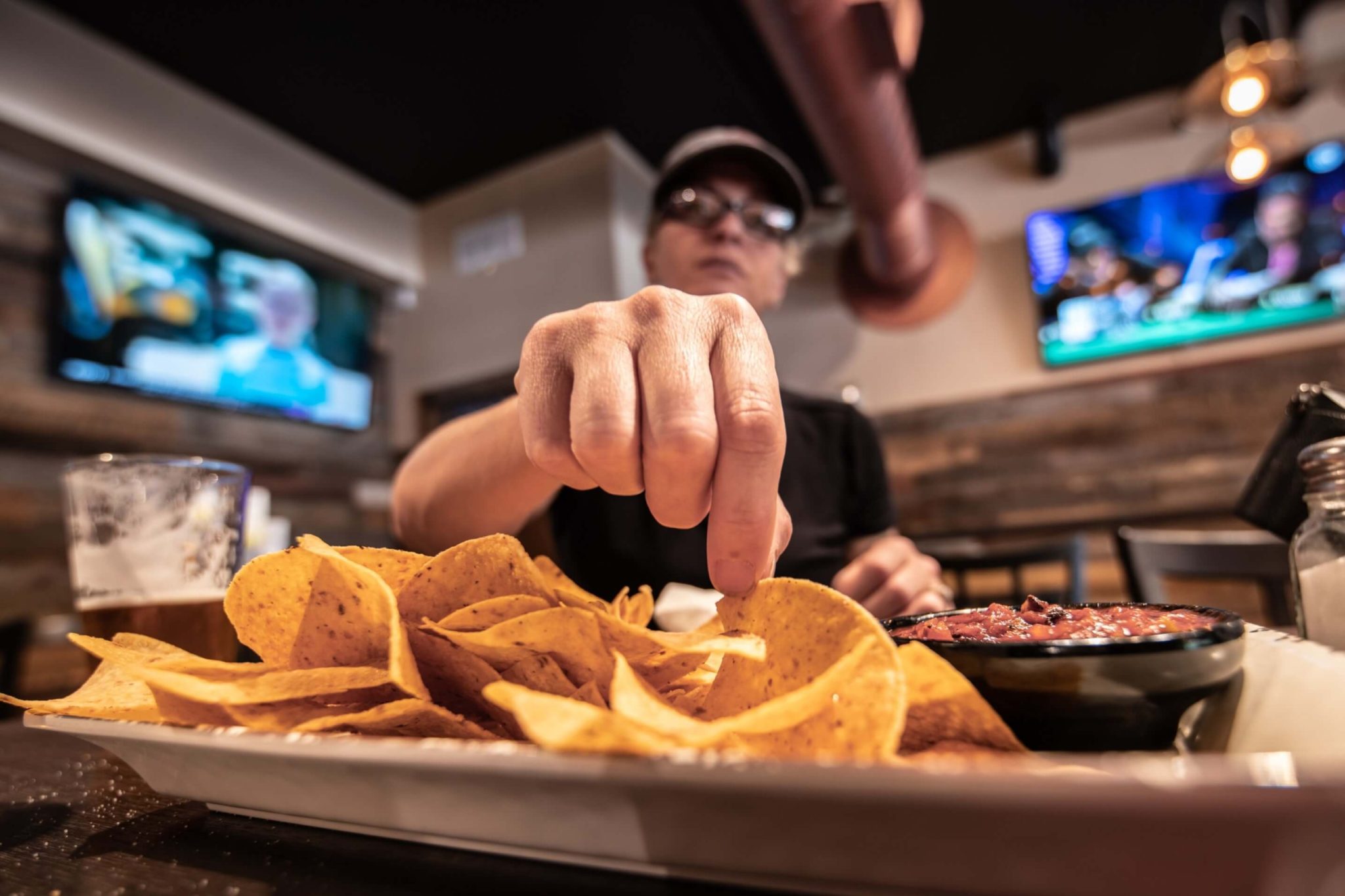 A man eating at a Tex Mex Restaurant.