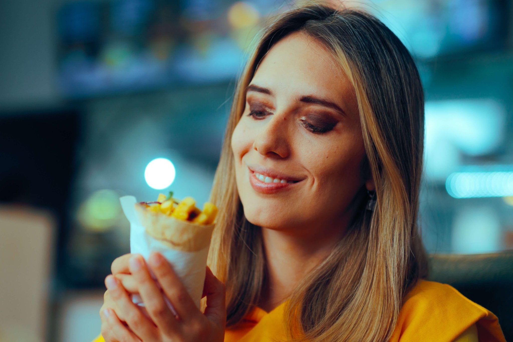 A woman enjoying Restaurants New Braunfels.